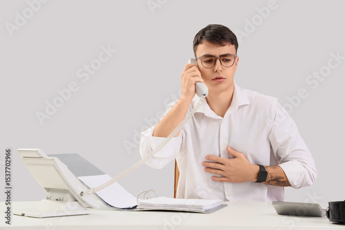 Worried male office worker ...