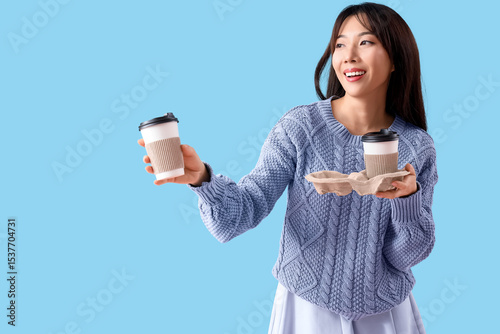 Young Asian woman with cups...