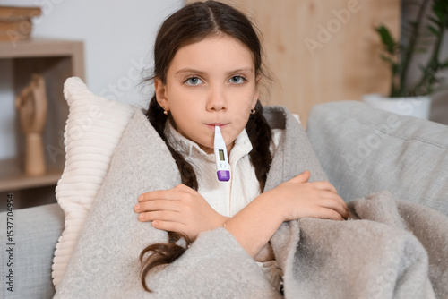 Sick girl with thermometer ...