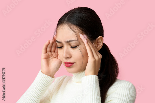 Young Asian woman suffering...