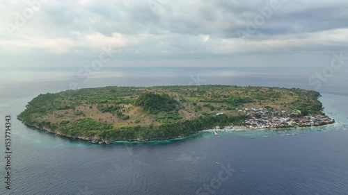 The island of Ternate is found in the north of Pantar Strait near Alor, Indonesia. This distinctive island is surrounded by coral reefs that receive strong currents that run through the strait.