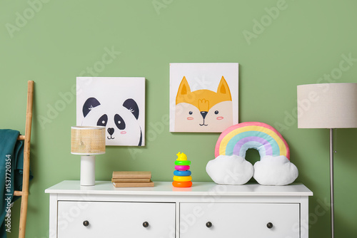 Lamps with toys on commode ...