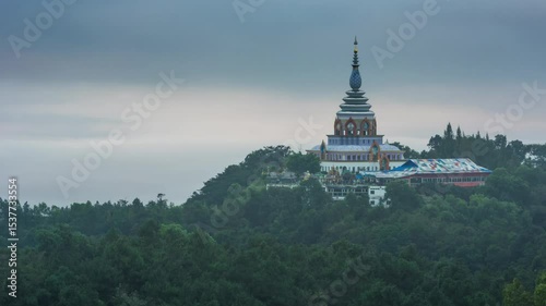 Wat Tha Ton is an ancient temple with a viewpoint on top of a mountain that overlooks the plains, communities, rice fields, and the meandering Kok River below, all surrounded by high mountains.