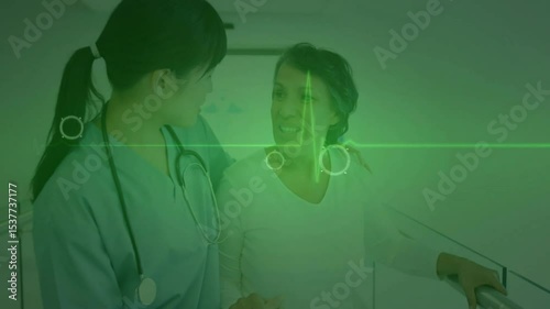 Patient walking bars with therapist guiding while pointer updating ECG waveform for rehabilitation