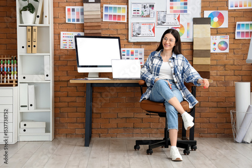 Female designer with blank ...