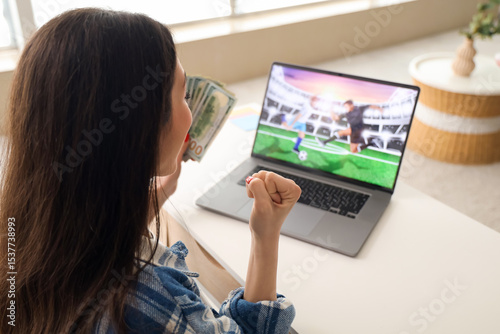 Happy young woman with mone...