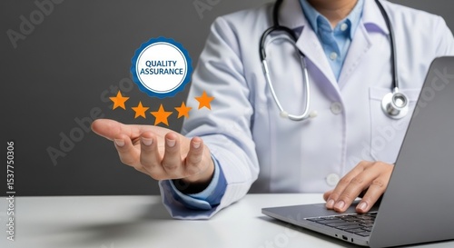 A doctor with quality assurance badge and stars using a laptop in a medical setting with stethoscope
