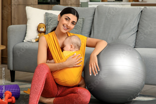 Sporty mother with her baby...