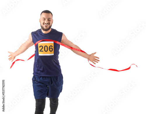 Happy male athlete crossing...