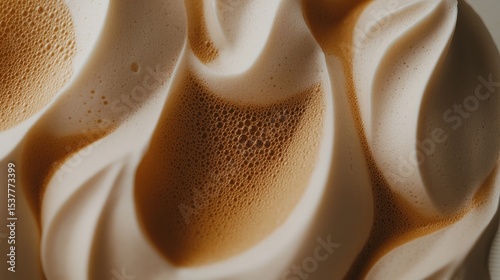 Close-up view of textured coffee foam.