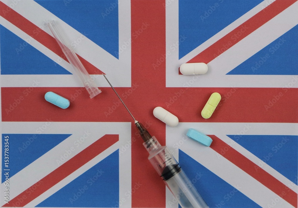 Fototapeta premium English flag with syringe and various drugs. Health and drug trafficking concept