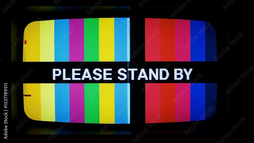 A vintage television screen displaying a colorful test pattern with 