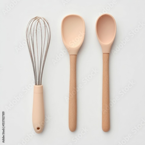 Pastel-colored kitchen tools arranged on a white background.  A whisk and two spoons
