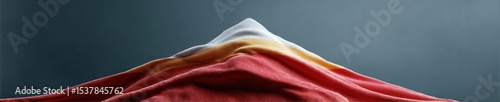 National Heroes Day Uganda Spanish Flag Fluttering Dramatic Lighting Elevated Patriotic Spirit with Reflective Textures for Cultural Celebration and Commercial Branding photo