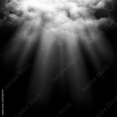 Light rays pierce through a cloudy, dark sky