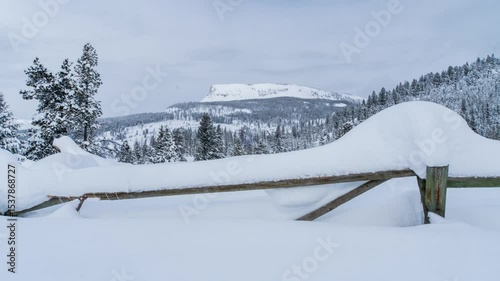 Fence deep snow in the mountains 