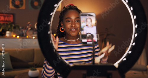 Foto Black woman, influencer and phone with ring light at house for introduction, late live streaming or social media