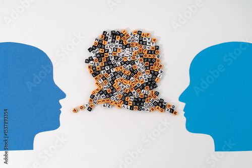 Two paper-cut heads facing each other, with streams of mixed letters flowing from their mouths symbolizing complex communication, shared thoughts, and the exchange of ideas or emotions or quarrel