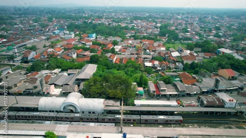 Aerial View from Drone of Two Commuter Trains Passing through A Station in Asia