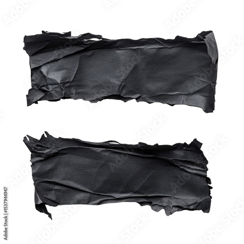 Two crumpled, dark gray rectangles