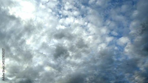 Dramatic Cloudy Sky with Sunlight Peeking Through the Atmosphere