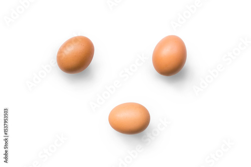 Closeup of brown organic free-range chicken eggs isolated on a transparent background with shadow from above, top view, png