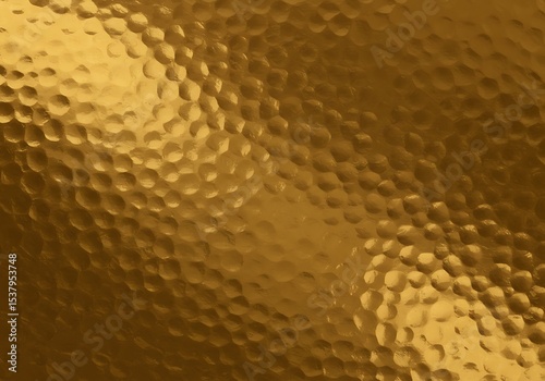 Golden hammered metal surface texture background
