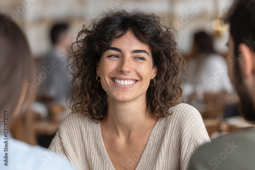 group of designers passionately discussing concept of new state emblem in bustling city cafe