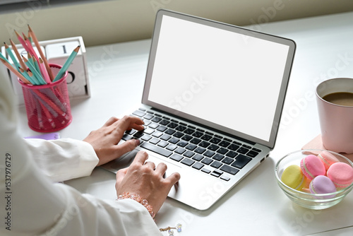 Woman hand using laptop and type on the keyboard, Mockup screen of advertisement.