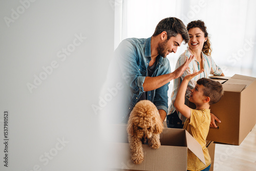 New home, box and parents with child in new house, property mortgage and real estate investment.