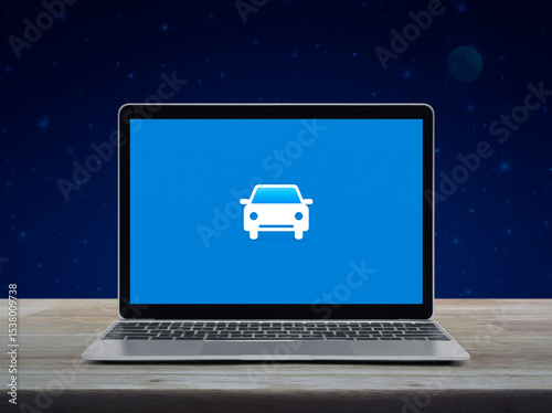 Car flat icon on modern laptop computer screen on wooden table over fantasy night sky and moon, Business transportation online service concept