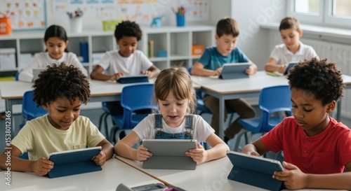 Diverse students using tablets in classroom