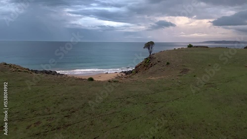 Aerial footage of Kelvedon Beach, Tasmania at sunrise. Captured after a night storm, the video shows moody skies, soft light, and serene coastal beauty in 4K.