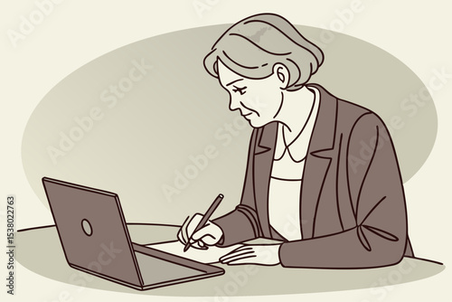 Serious mature older adult woman watching training webinar on laptop working from home or in office. 60s middle aged businesswoman taking notes while using computer technology sitting at table