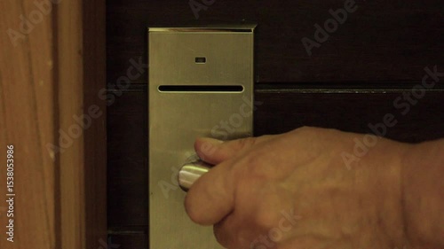 Wrong room open, red light, cannot be opened. Close-up, Hand of man opening the door of an apartment or hotel room with a chip card or smart card. Security technology