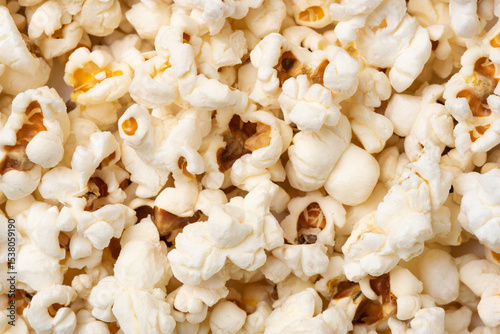 Background in the form of salted popcorn. Flat lay, top view