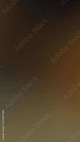 Blurry gradient with dark brown and olive green hues. Suitable for backgrounds, abstract designs, and natureinspired projects. Versatile and modern.