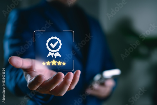 Tableau sur toile Quality assurance concept with businessman holding 5-star rating and checkmark badge icon