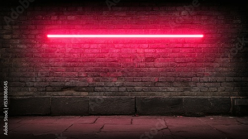 Red neon light illuminates a brick wall above a dark floor.