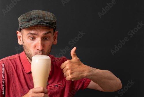 Beer Lover Enjoying Freshly Tapped Beer with Foam, Thumbs Up from Happy Drinker