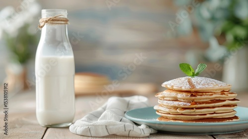 A vintage milk bottle beside a stack of freshly baked buttermilk pancakes.