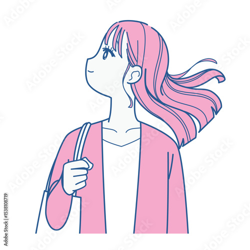 髪をなびかせる若い女性