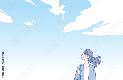 髪をなびかせる若い女性