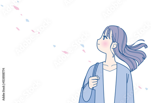 髪をなびかせる若い女性