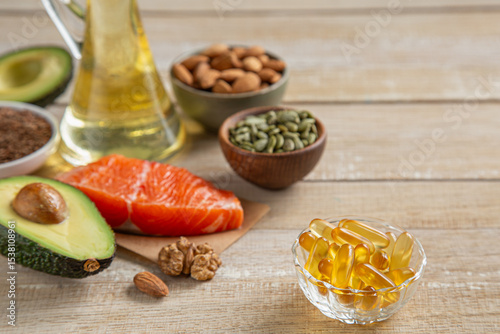 food sources of unsaturated fatty acids, omega 3 and vitamin D products  and fish oil supplement capsules