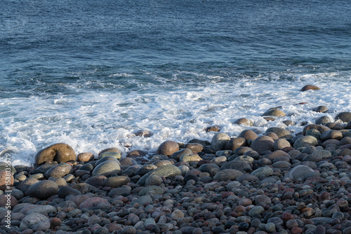 Stones Beach of dragon eggs in the shelter. The shore of the Barents Sea. Teryberka, Russia