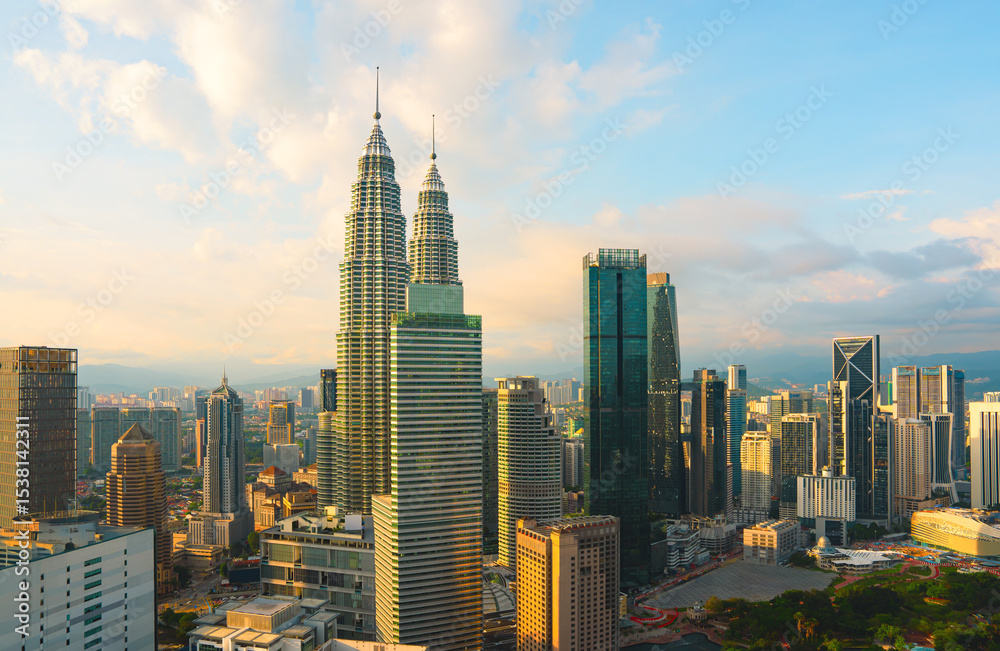 Obraz premium Panorama aerial serene view of beautiful Kuala Lumpur city skyline during sunset.
