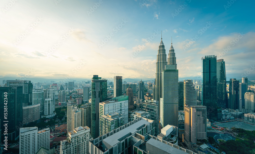 Fototapeta premium Panorama aerial serene view of beautiful Kuala Lumpur city skyline during sunrise.