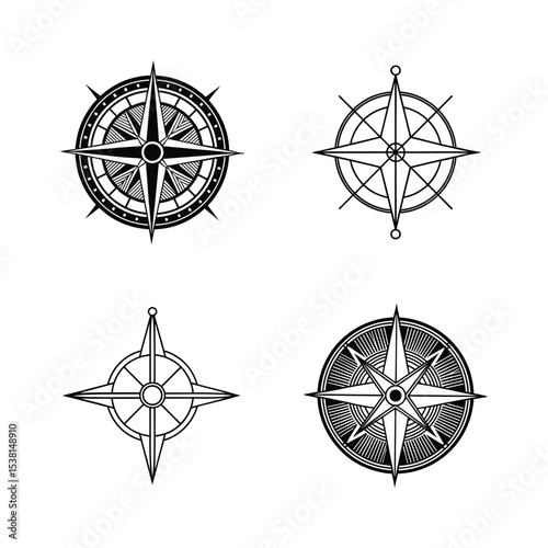 Set of four elegant black and white compass rose designs for navigation and exploration
