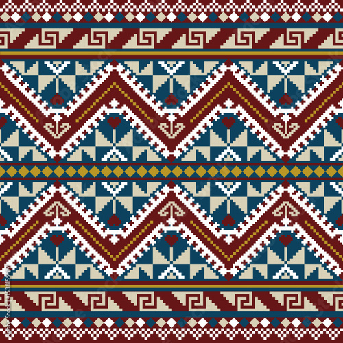 Bold pixel art pattern with tribal zigzag bands, heart motifs, and cultural symbols in red, navy, and cream tones.
